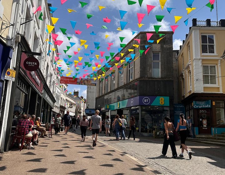 Falmouth Town high street with shops and bunting