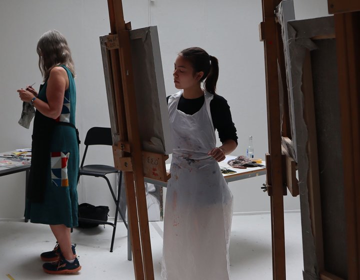 People painting from easels