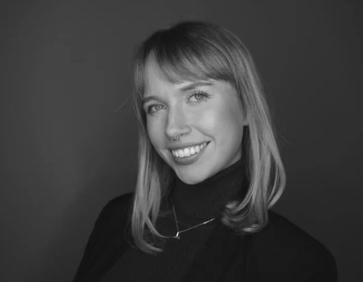 A woman smiling into the camera