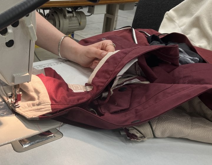 A student using a sewing machine