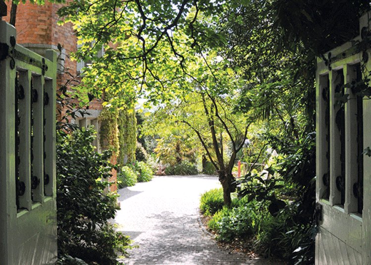 The view through the gates of the garden on Falmouth campus