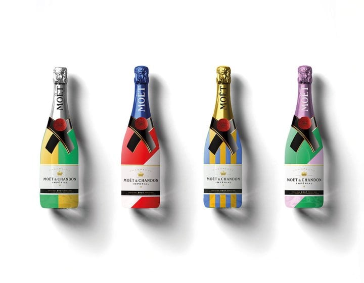 Bright coloured labelled champagne bottles