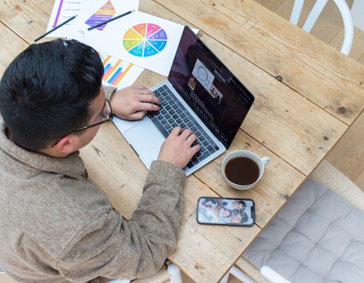 An online student working from their dining table