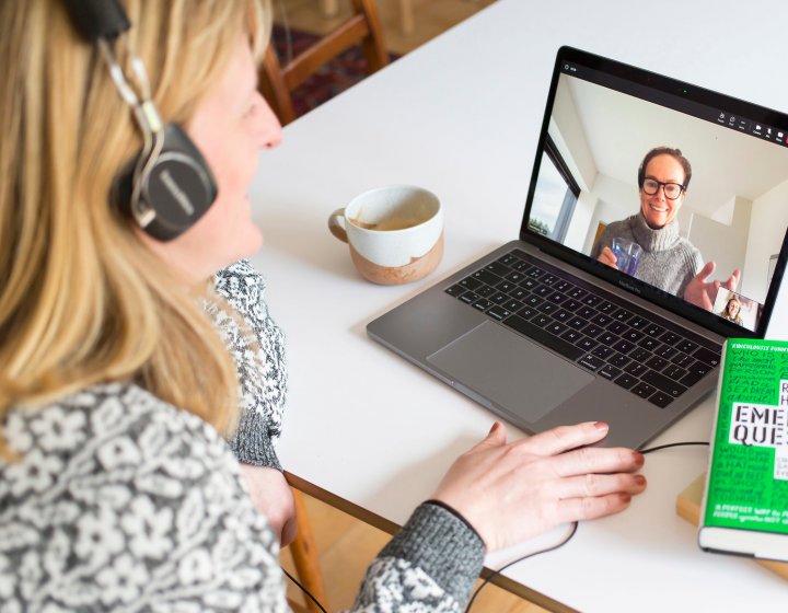 Adult learner taking part in an online seminar on their laptop 