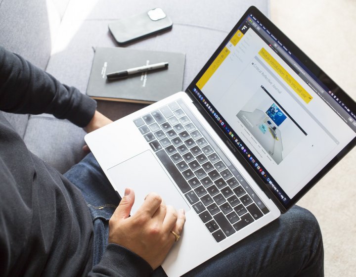 A short course student working on their laptop