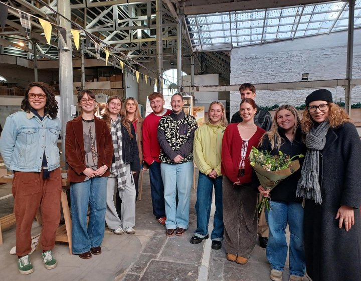 A group of Interior Architecture students and lecturer in a building interior