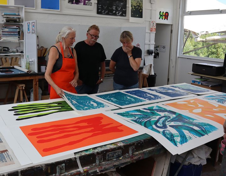 People looking at large scale screenprints