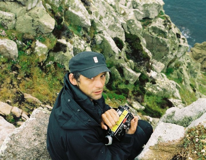Mark Jenkin poses with his Kodak B&W camera