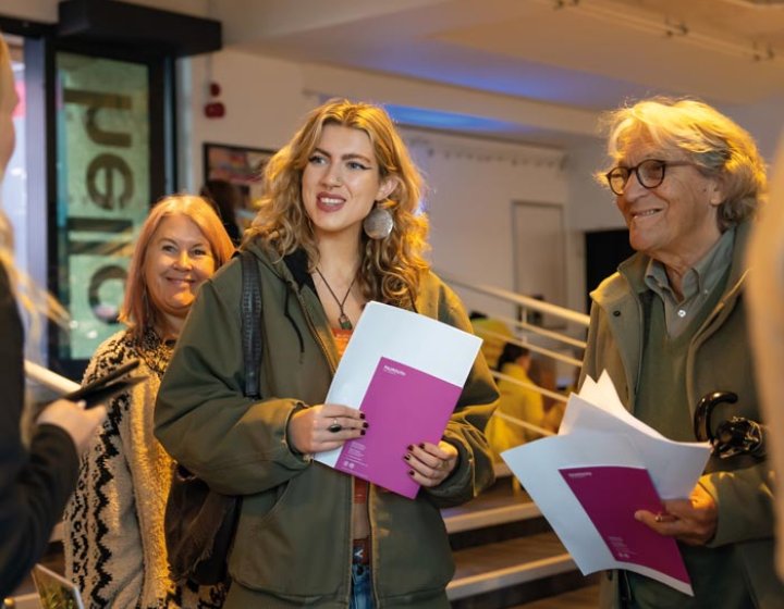 A young woman with her parents at a Falmouth University Open Day