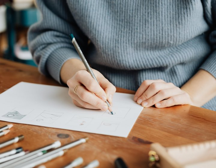 Close up of a woman drawing a sketch