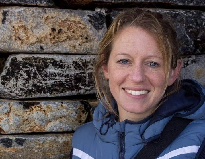 A woman smiling into the camera