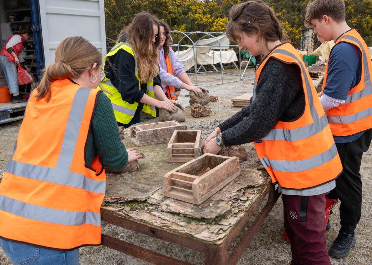 Students at a brickworks
