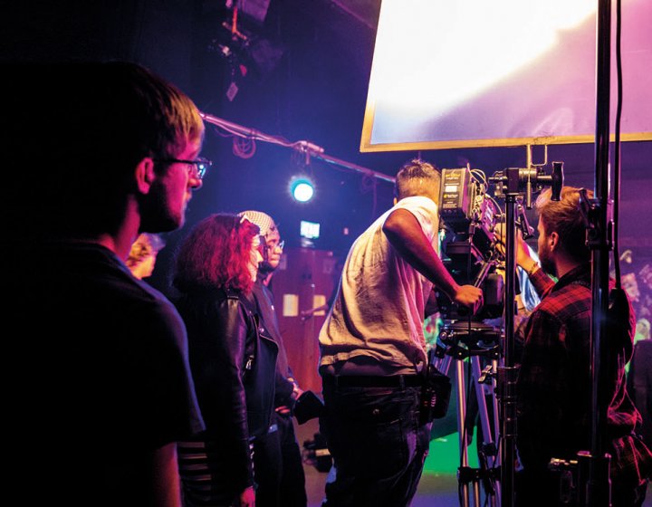 Students filming in a studio