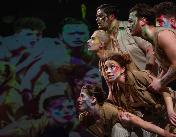 A group of acting students on stage