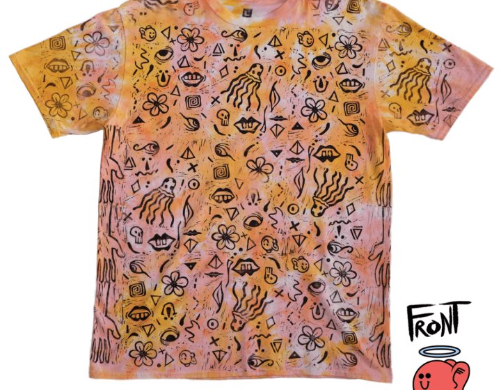 orange tie dye t-shirt with black symbols