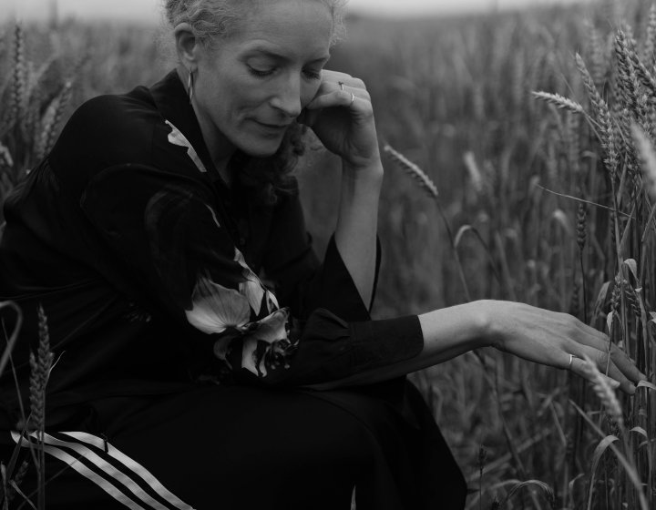 A woman sat in a field