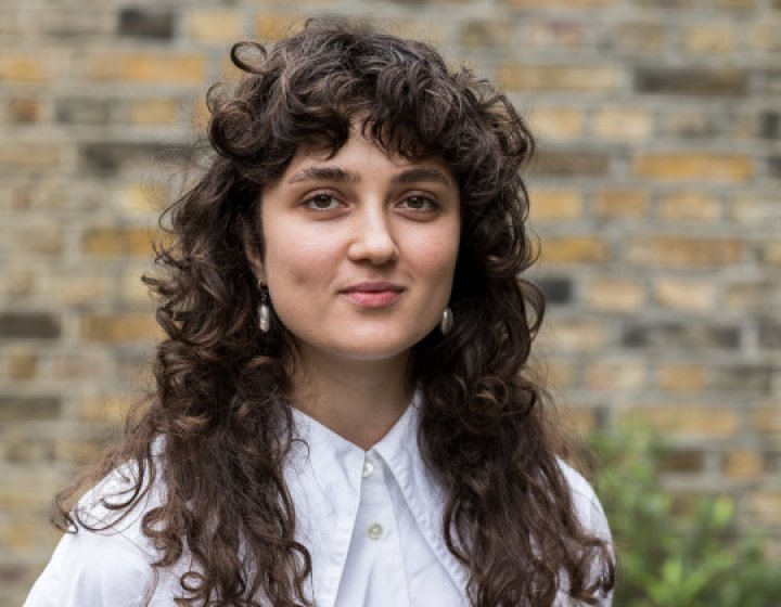 A woman smiling into the camera