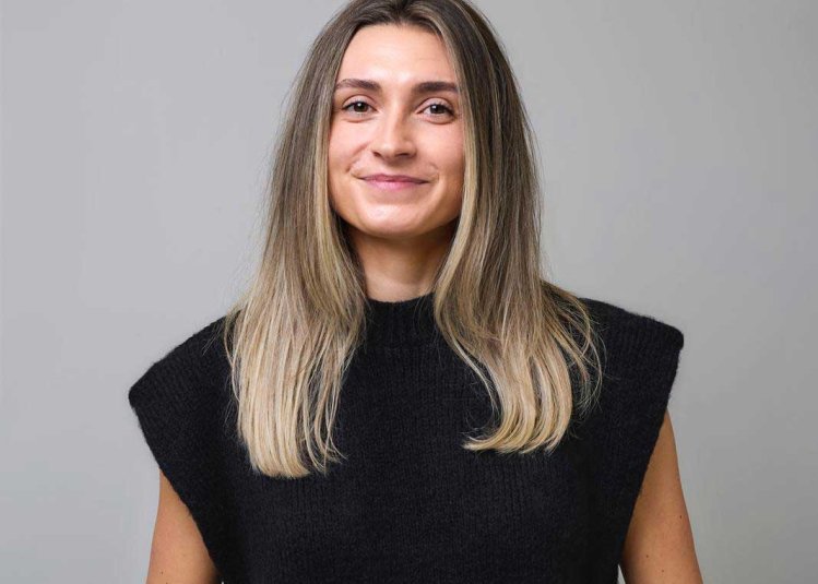 A woman smiling into the camera