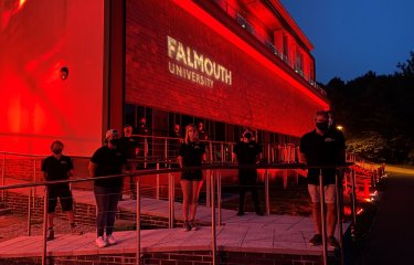 Falmouth University AMATA building shines red in support of #WeMakeEvents