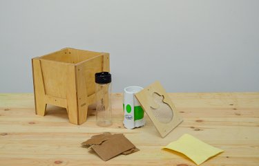 Wooden box with duck panel and a plastic bottle