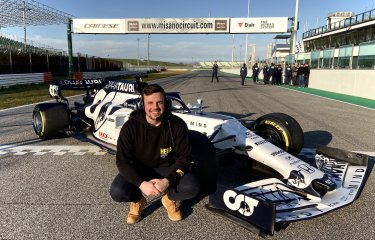 Elliott Harrison with Formula 1 car 