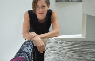 Fiona Sperryn In a textile studio with a weave