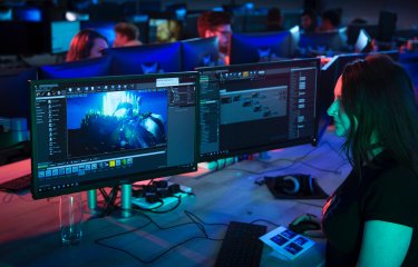 Student in Falmouth University's games academy working on digital illustrations
