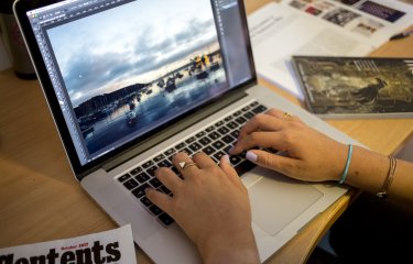 Student studying at laptop and desk