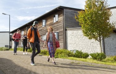 Students walking and chatting.