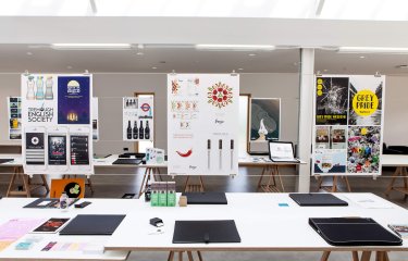 Graphic design work presentations suspended in studio at Falmouth University