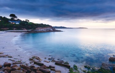 View of Swanpool beach at dusk