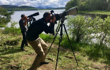 Two men with cameras on tripods