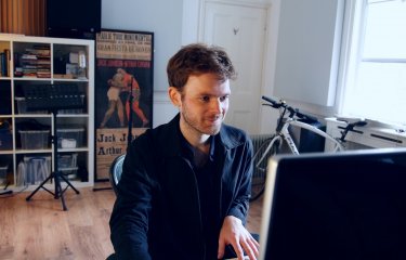 Graduate, Joe Donohoe, on the piano 