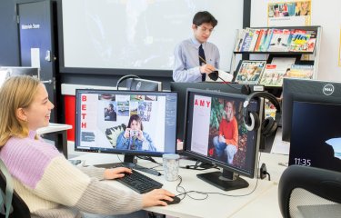 Falmouth University Media Production student looking at two computer screens