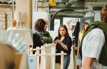 Family exploring workshop on an open day.