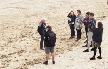 Sustainable Tourism Management students with tour guide on Portreath beach