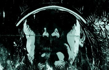 Black and purple artwork of a man in a cap