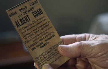 hand holding a ticket