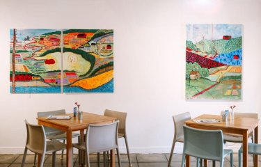 Seats and paintings in a cafe environment