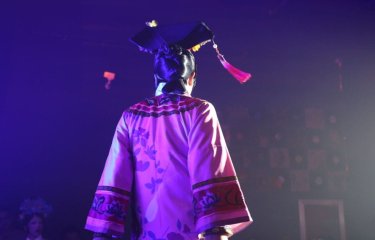 The back of a figure wearing a traditional Chinese costume