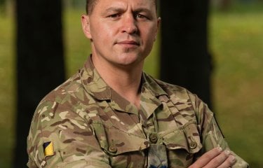 A man wearing camo 