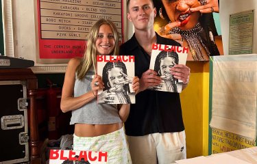 Montana Cooke and Alex Wilson holding their magazine entitled Bleach