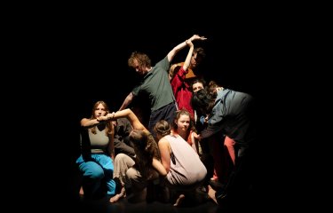 A group of performers on stage