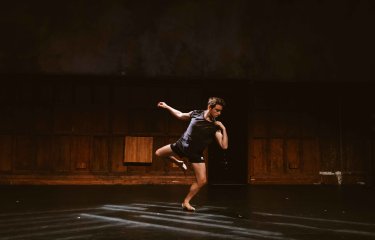 A performer dance on stage