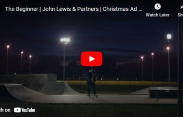 A man on a skateboard at night