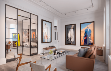Interior design of a furnished apartment with a leather sofa, glass internal doors and large photos