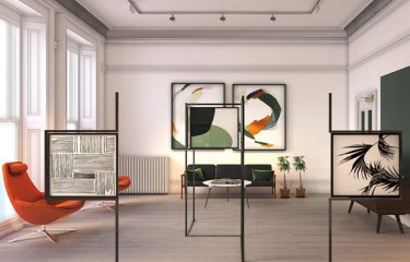 Interior design of large room with orange and green chairs and framed patterns