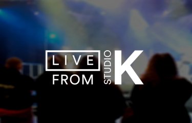 Blurred photo of an audience from behind, with the text 'Live from Studio K' overlaid in white.