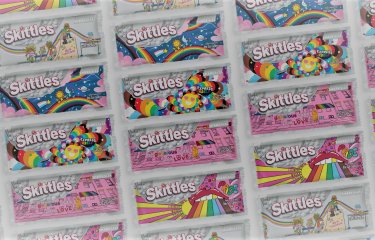 Screenshot of Skittles' Pride webpage banner featuring rainbow-less packets of Skittles.