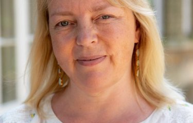 A headshot of academic Amber Burton 